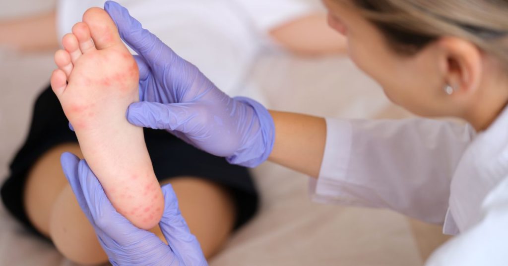 Podiatrist examining a patient's foot