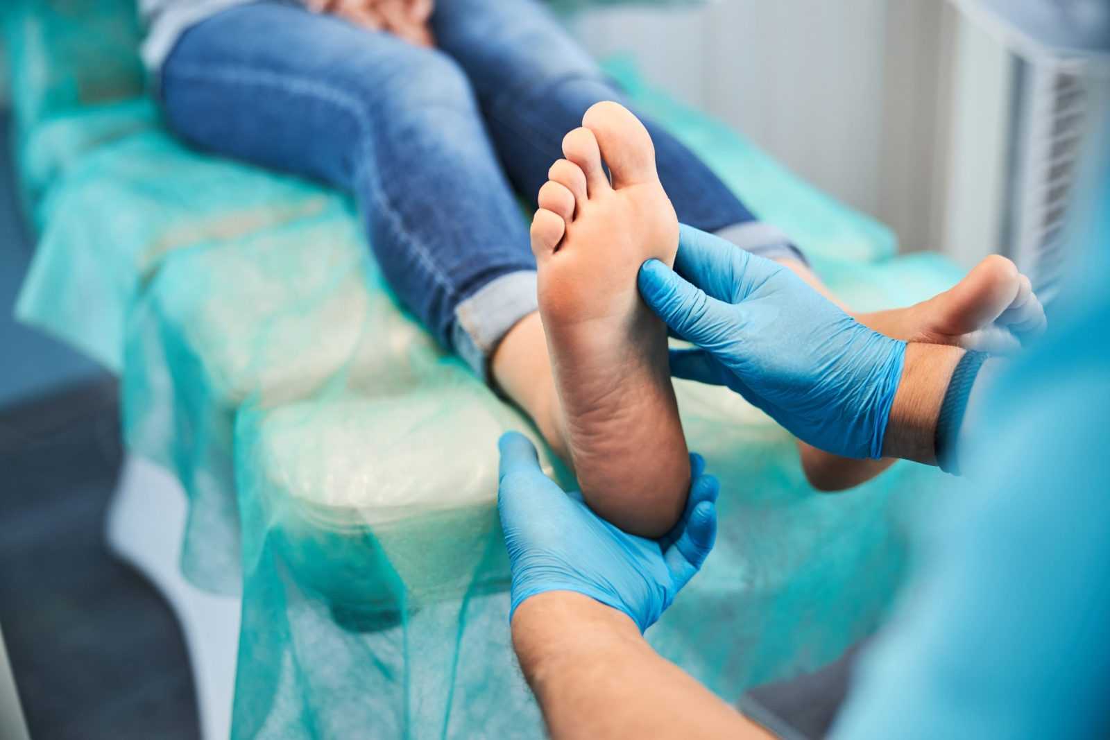podiatrist checking foot of a patient